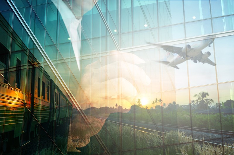 Double Exposure of BusinessMan write something and Train, Airplane as Business Transportation or Logistics Concept.